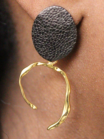 a woman wearing non tarnish, budget friendly 18k gold plated arc earrings