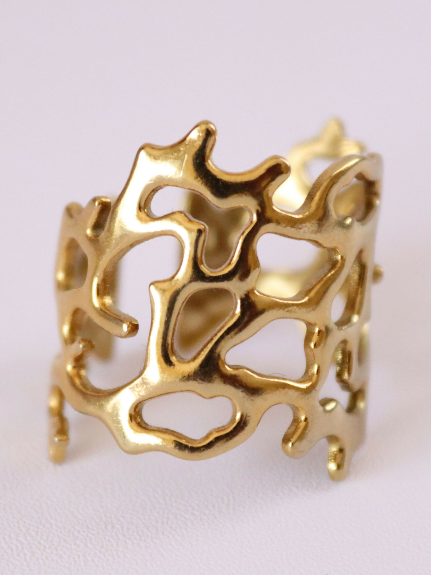 close up view of 18k gold plated flowy ring