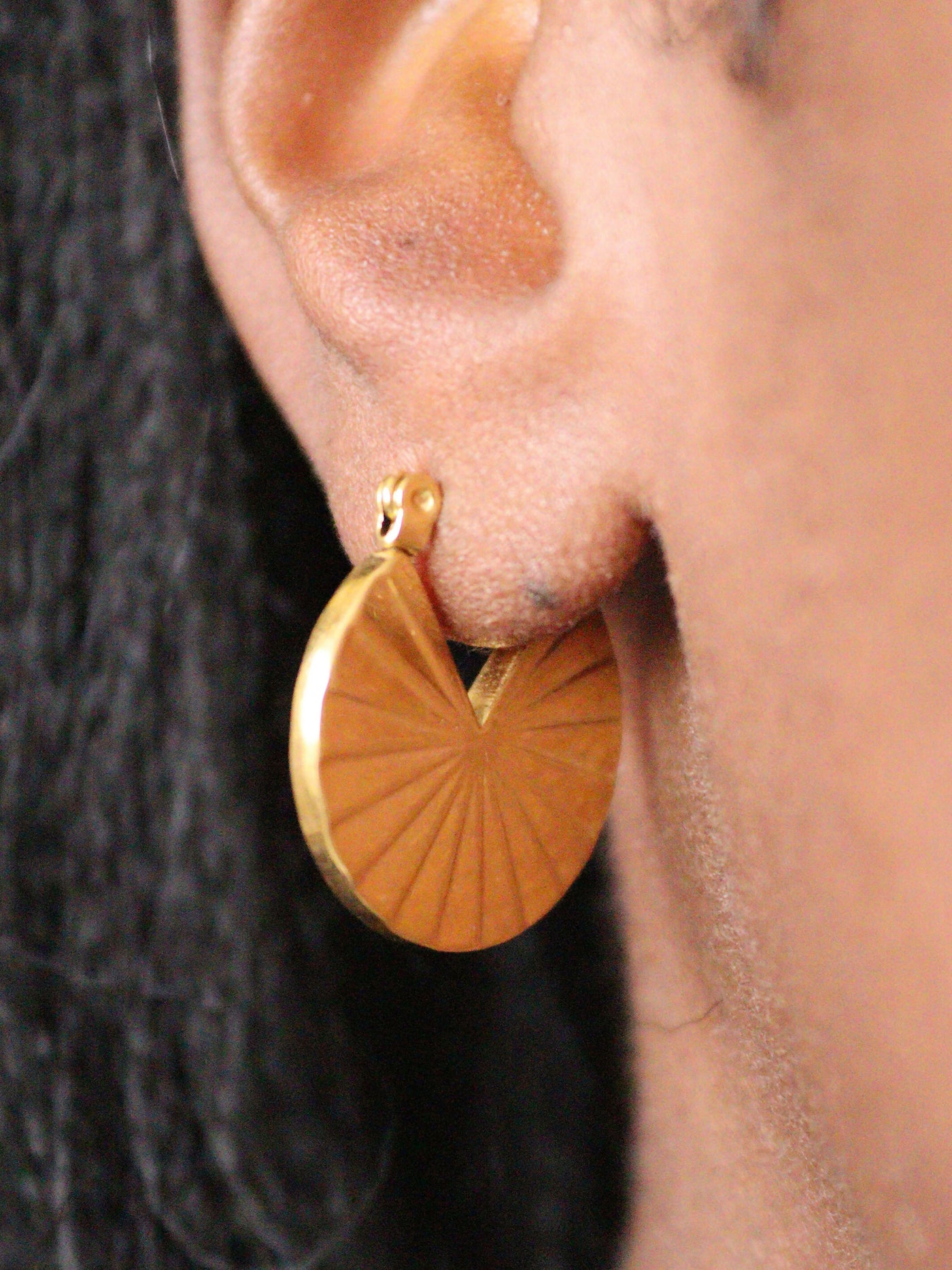 a woman wearing non tarnish, budget friendly 18k gold plated fan hoop earrings