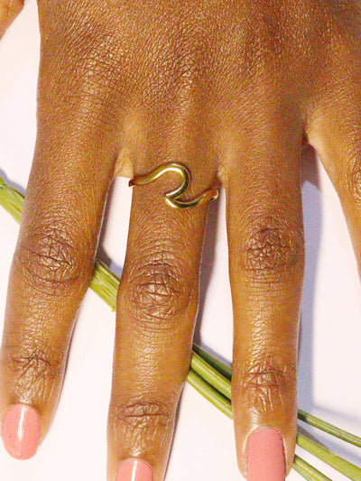 a woman wearing non tarnish, budget friendly 18k gold plated wave ring