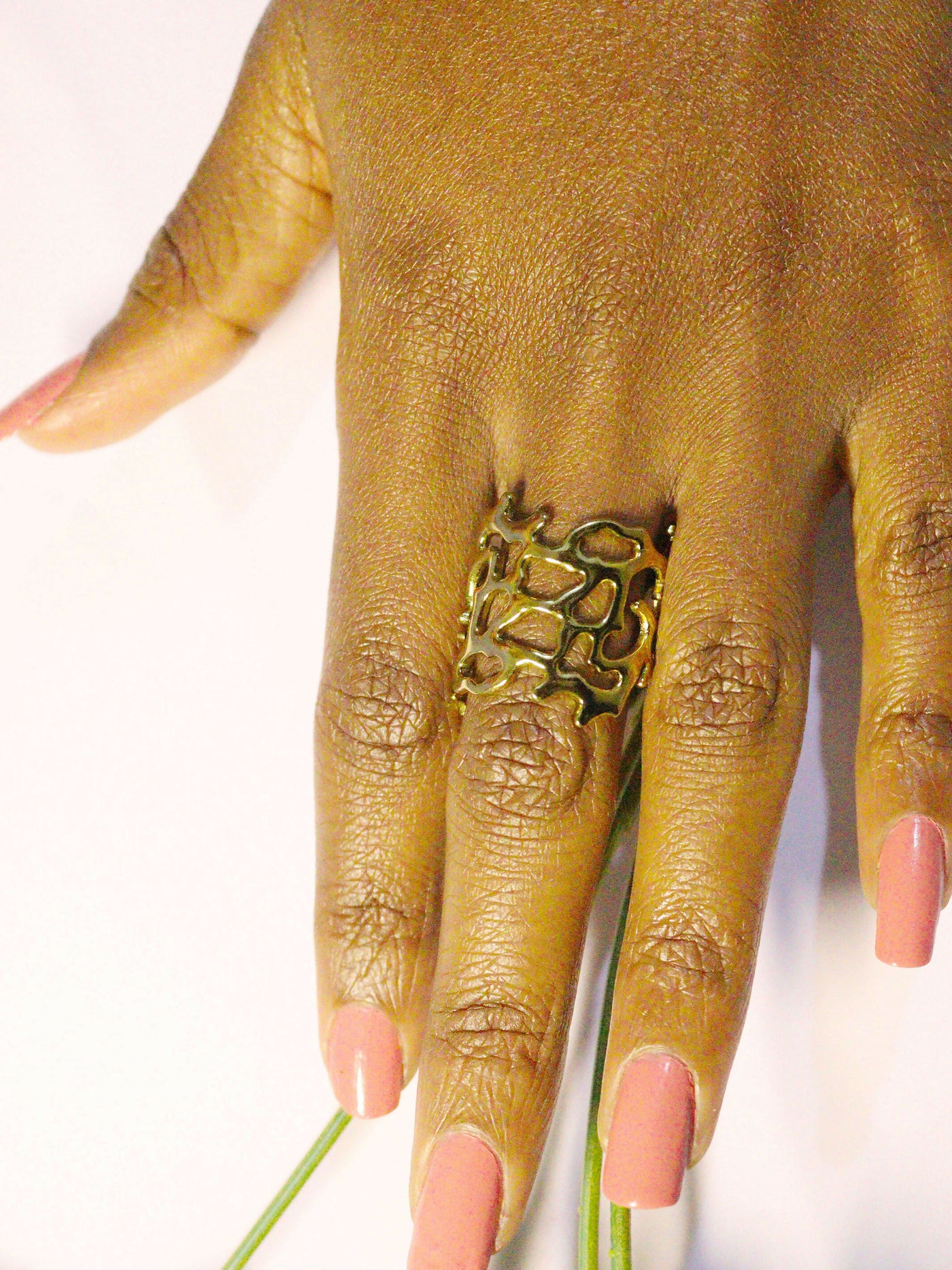 a woman wearing non tarnish, budget friendly 18k gold plated flowy ring